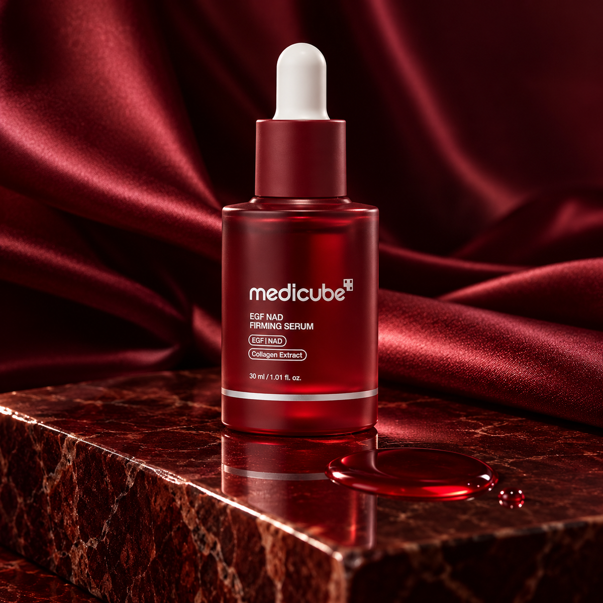 Medicube serum on burgundy stone with red serum