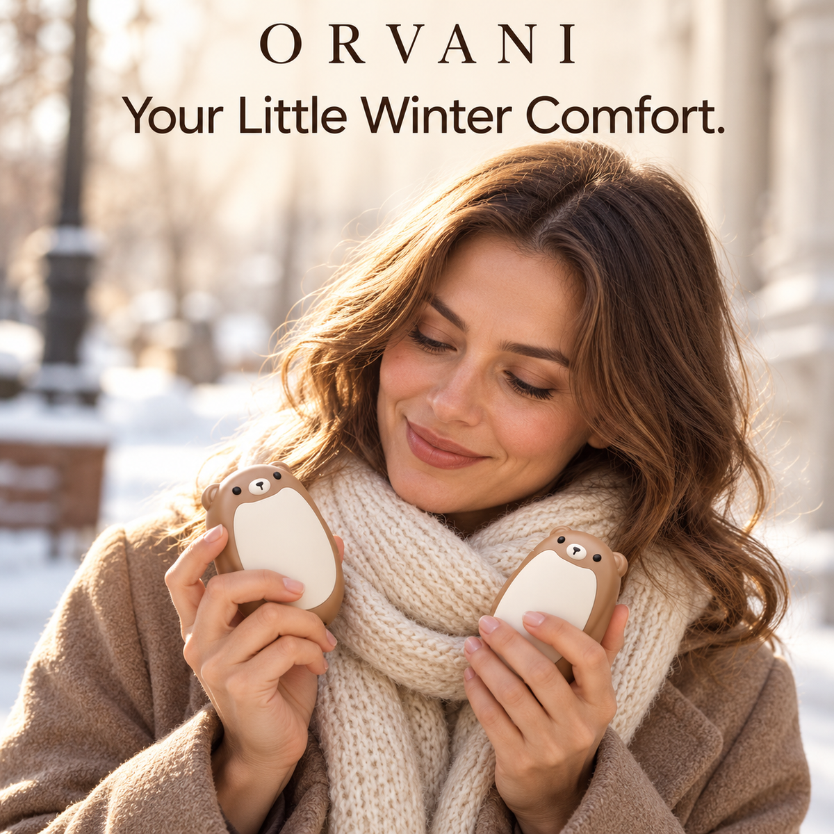 Woman holding Orvani bear hand warmers outdoors