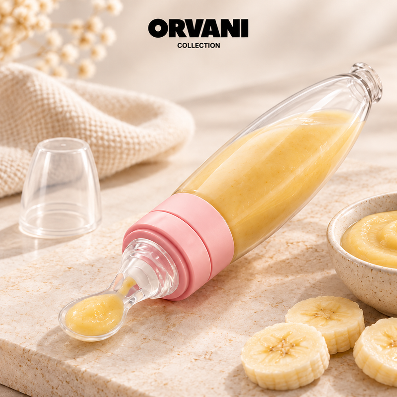 Pink baby spoon feeder with banana purée